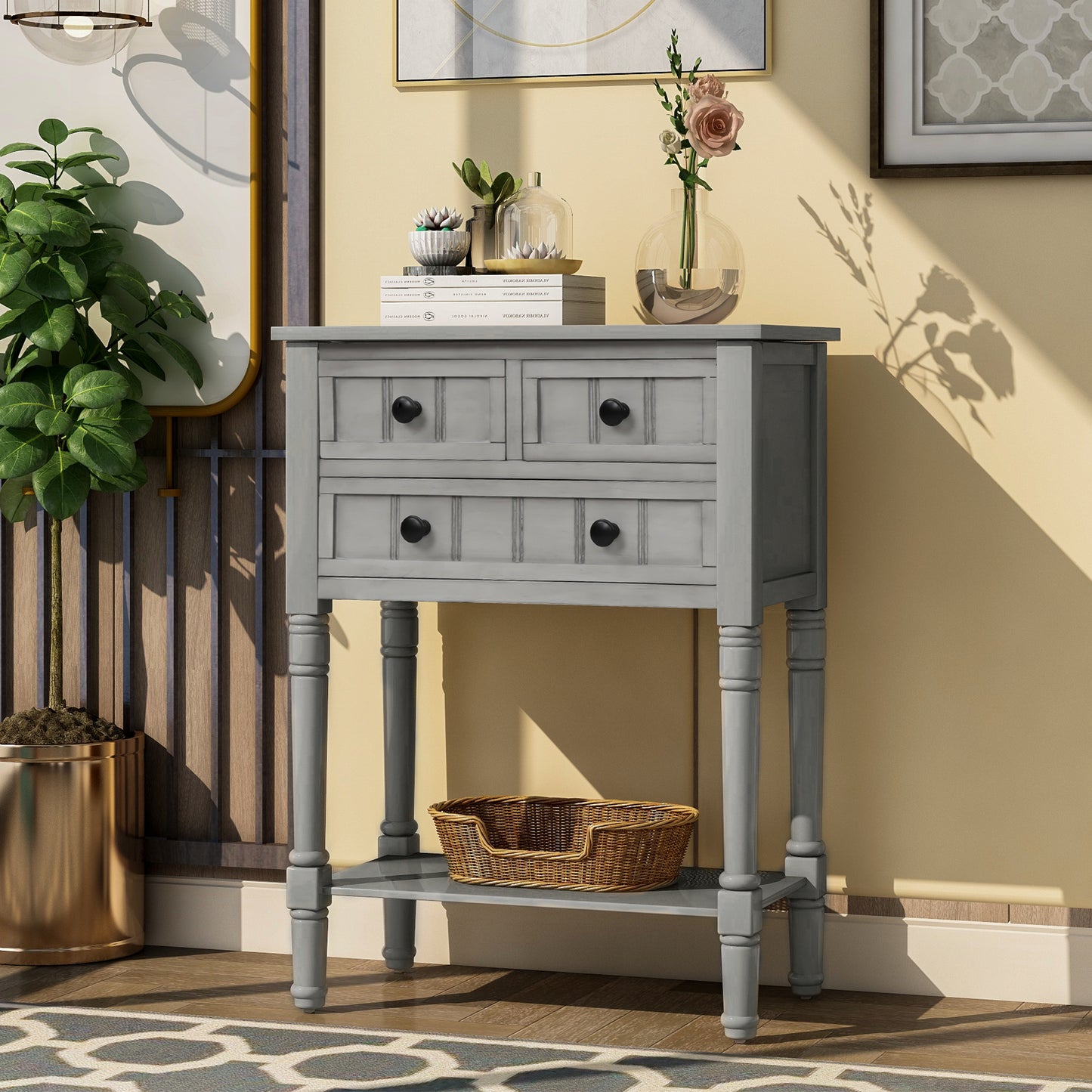 Slim grey-washed console desk with three drawers and bottom shelves. Space-saving sofa table perfect for living rooms, entryways, and hallways.