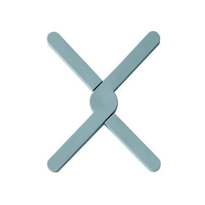 X-shaped heat-resistant silicone dining table mat with non-slip design. Protects surfaces from heat, spills, and scratches—stylish and practical for everyday use.