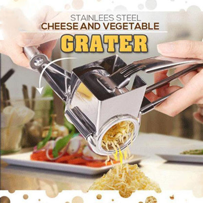 Stainless steel cheese and vegetable grater with food being grated on a blurred background

