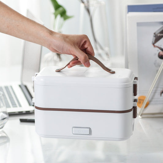 Portable electric lunch box with stainless steel liner for fast heating and steaming. Compact, leak-resistant, and ideal for home, office, and travel meals.
