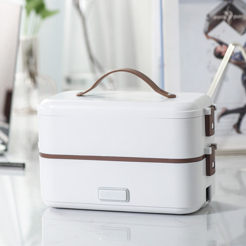Portable electric lunch box with stainless steel liner for fast heating and steaming. Compact, leak-resistant, and ideal for home, office, and travel meals.