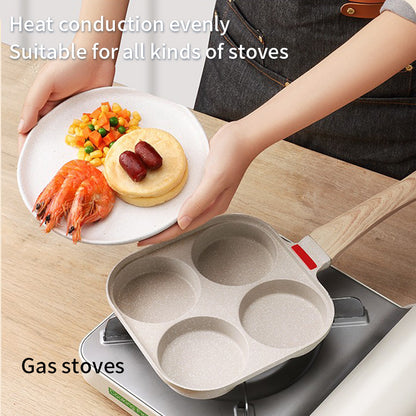 Non-stick four-hole breakfast pan for frying eggs, pancakes, and burger toppings evenly. Perfect for quick, mess-free home cooking.
