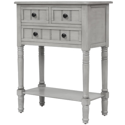 Slim grey-washed console desk with three drawers and bottom shelves. Space-saving sofa table perfect for living rooms, entryways, and hallways.